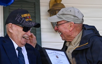 Centennial birthday parade honors WWII veteran