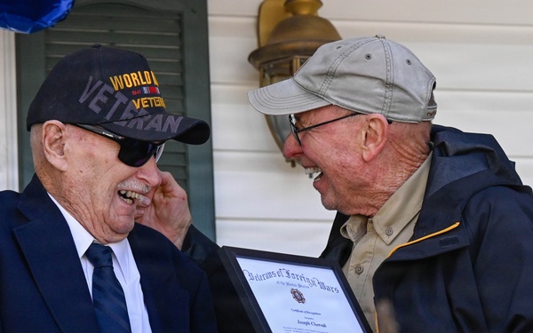 Centennial birthday parade honors WWII veteran