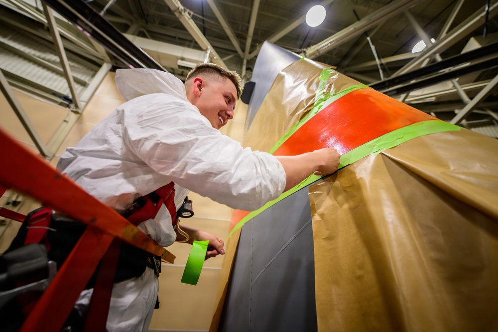 Wyoming Airmen Paint the Tail That Tells the Story