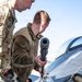 Weapons backshop inspects a gun on an F-16 Fighting Falcon