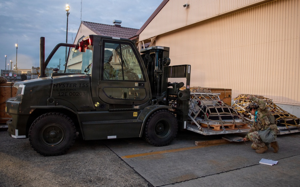 374 AW loads cargo during BM26