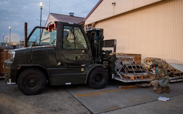 374 AW loads cargo during BM26