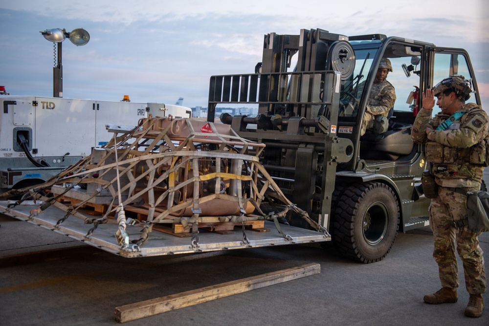 374 AW loads cargo during BM26