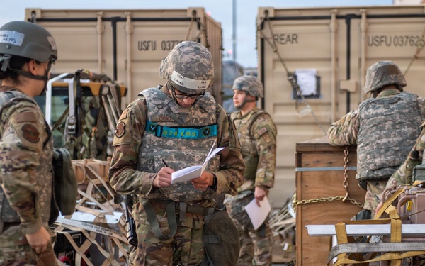 374 AW loads cargo during BM26