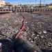 Holding the Line: Navy Crews Intercept Massive Debris Before It Enters Waterways