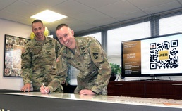 JB MDL leaders sign ceremonial check at AER kick-off