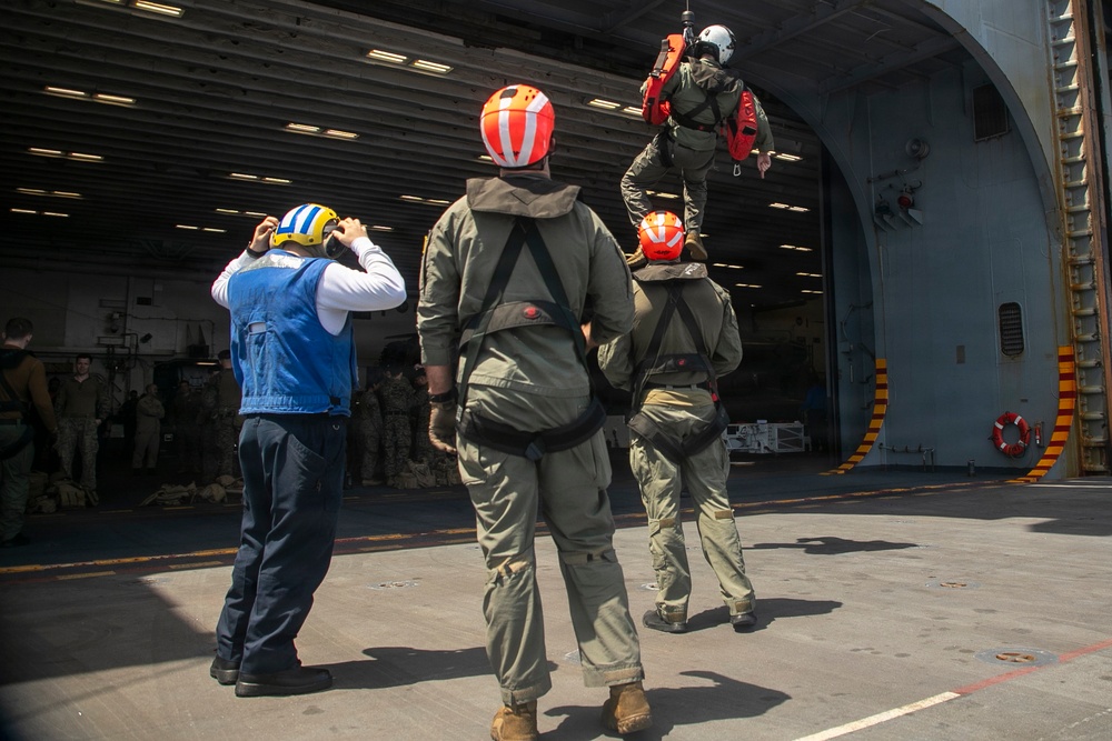 USS Tripoli Conducts Hoisting Exercise on Aircraft Elevator