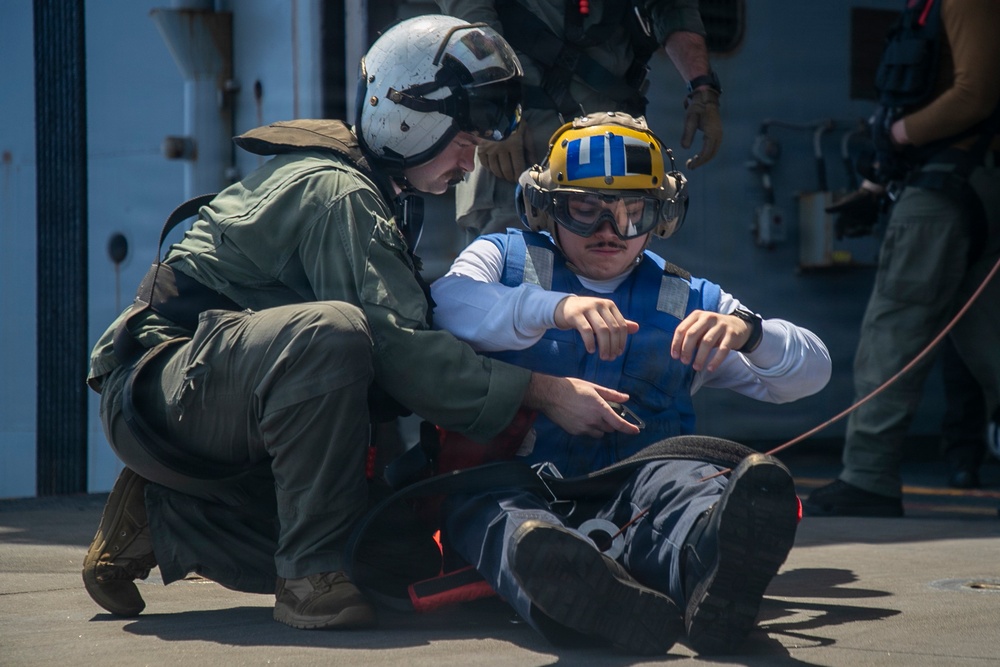 USS Tripoli Conducts Hoisting Exercise on Aircraft Elevator