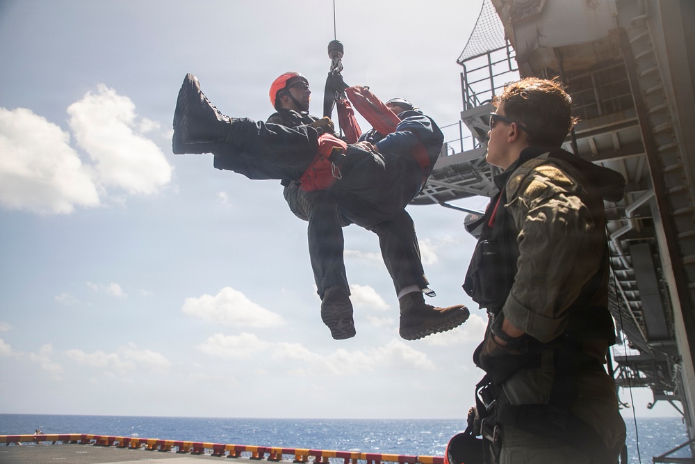 USS Tripoli Conducts Hoisting Exercise on Aircraft Elevator