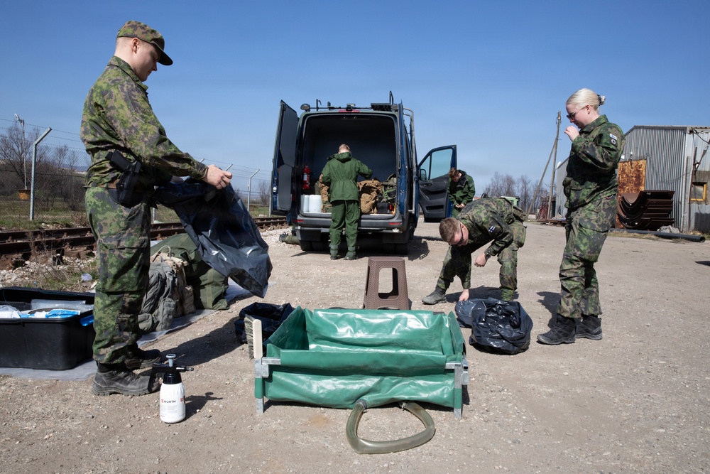 Finnish CBRN engineers inspect hazardous materials in support of KFOR