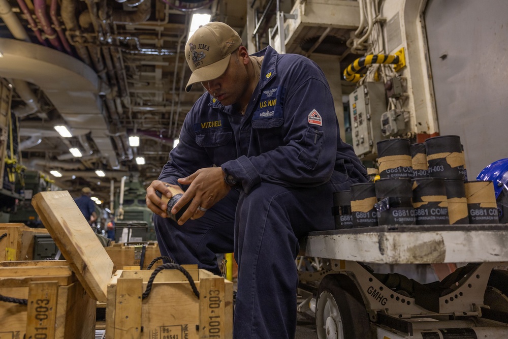 USS Iwo Jima Sailors Onload Ammunition