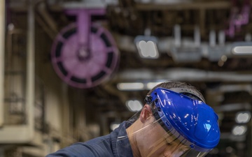 USS Iwo Jima Sailors Onload Ammunition