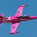Pink jet flies over Luke Air Force Base