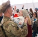 Iowa Soldier Holds Infant at Welcome Home Ceremony in Des Moines