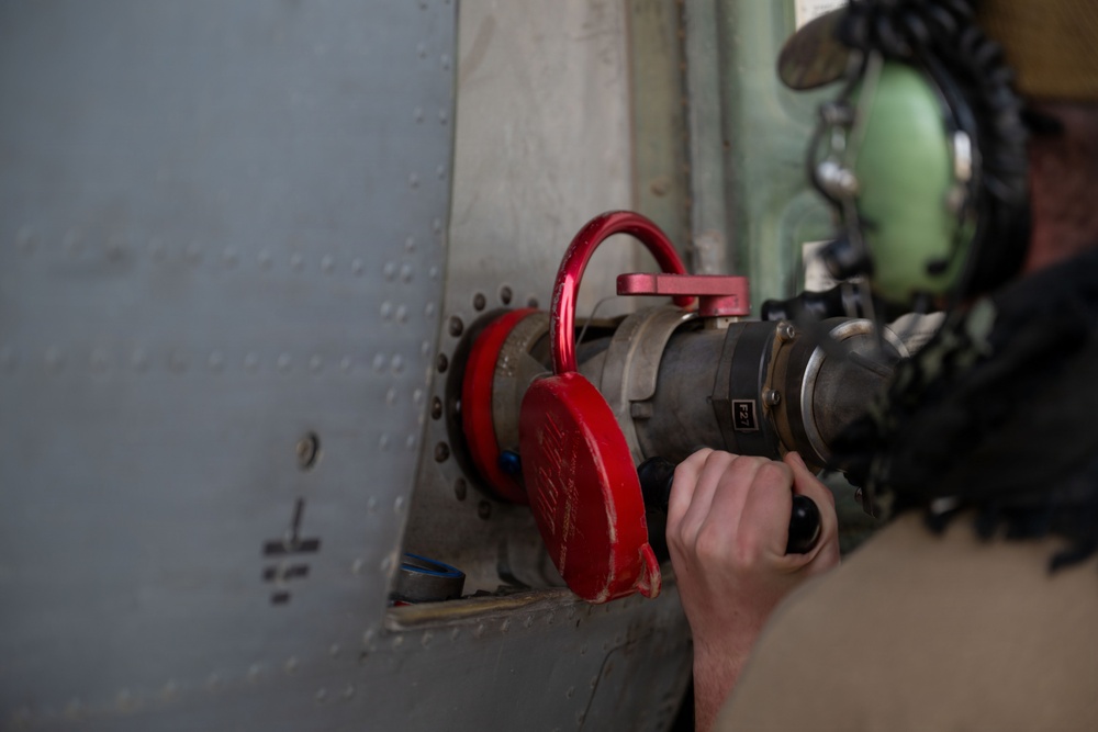 Ground Crews Marshal C-130 During Operation Epic Fury