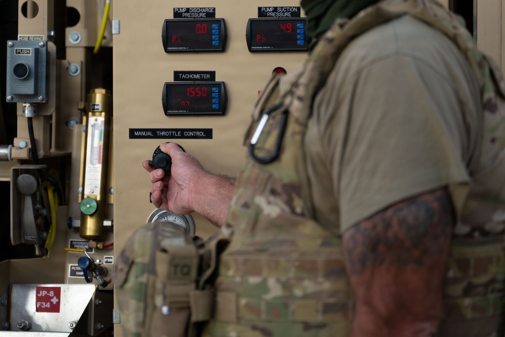 Ground Crews Marshal C-130 During Operation Epic Fury