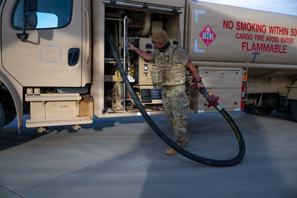 Ground Crews Marshal C-130 During Operation Epic Fury