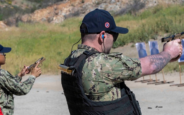USS America (LHA 6) Sailors Conduct Small Arms Qualification Shoot