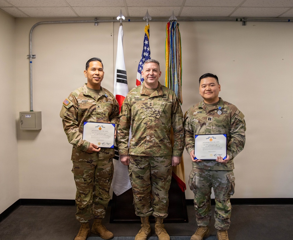 Capt. Donbosco A. Hein and Sgt. Eugene P. Arbis of the 498th CSSB received the Army Achievement Medal (AAM) from Maj. Gen. Justin W. Osberg, deputy combined rear area coordinator, United States Forces Korea (USFK) on Mar. 24.