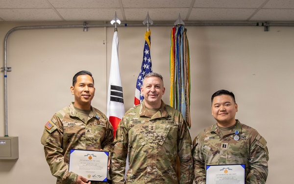 Capt. Donbosco A. Hein and Sgt. Eugene P. Arbis of the 498th CSSB received the Army Achievement Medal (AAM) from Maj. Gen. Justin W. Osberg, deputy combined rear area coordinator, United States Forces Korea (USFK) on Mar. 24.