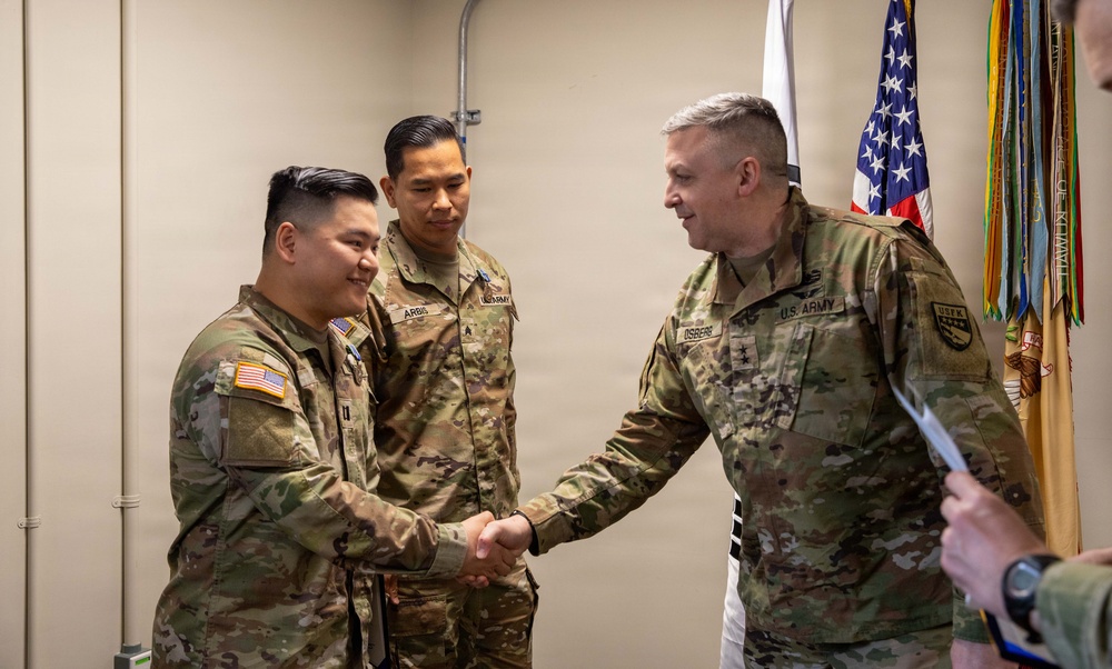 Capt. Donbosco A. Hein and Sgt. Eugene P. Arbis of the 498th CSSB received the Army Achievement Medal (AAM) from Maj. Gen. Justin W. Osberg, deputy combined rear area coordinator, United States Forces Korea (USFK) on Mar. 24.