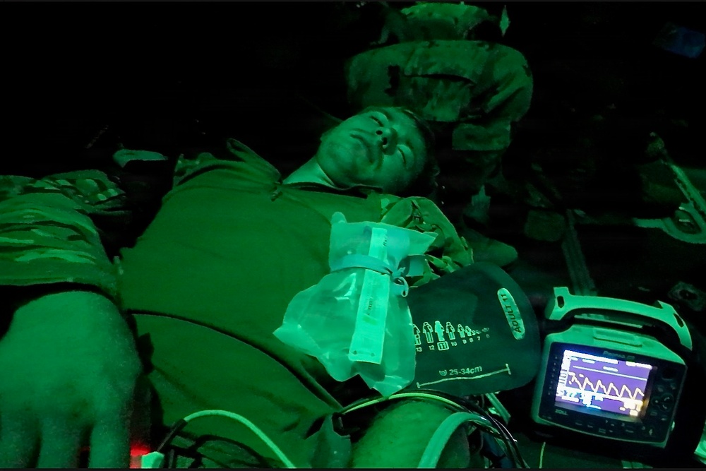 U.S. Soldiers and Airmen conduct a nighttime mass casualty medevac exercise on a C-130J Super Hercules during exercise Sentry South 26-2.