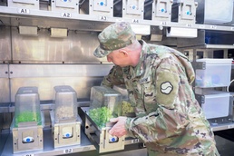 Soldier loads ingredients into autonomous system