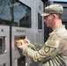 Soldier retrieves meal from autonomous kitchen