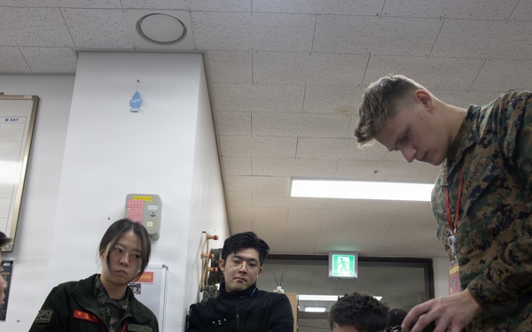 5th Air Naval Gunfire Liaison Company Marines conduct pre-mission gear inspections and establish communications during Freedom Shield 26