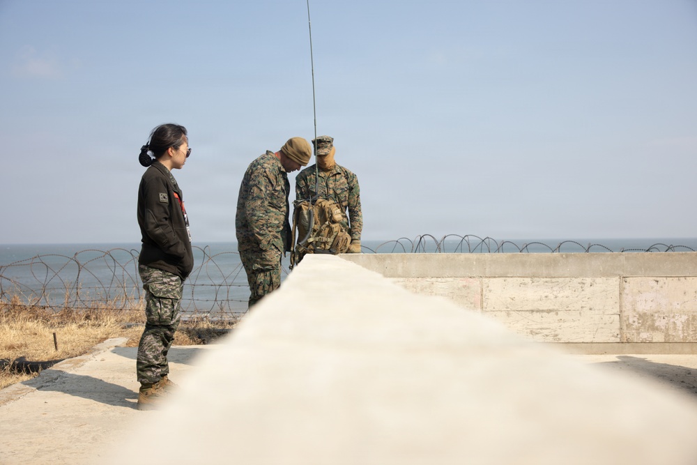 5th Air Naval Gunfire Liaison Company Marines conduct pre-mission gear inspections and establish communications during Freedom Shield 26