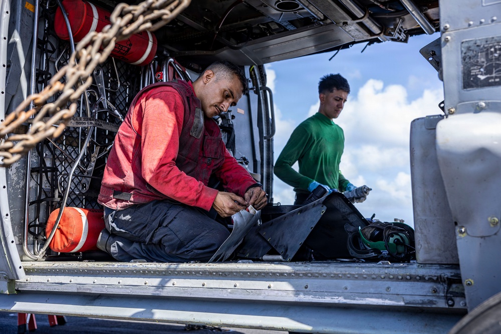 USS Iwo Jima Sailors Conduct MH-60S Sea Hawk Maintenance