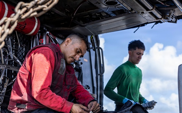 USS Iwo Jima Sailors Conduct MH-60S Sea Hawk Maintenance