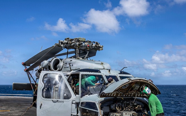 USS Iwo Jima Sailors Conduct MH-60S Sea Hawk Maintenance