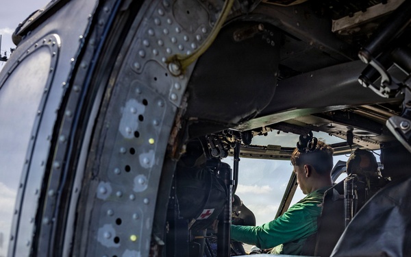 USS Iwo Jima Sailors Conduct MH-60S Sea Hawk Maintenance