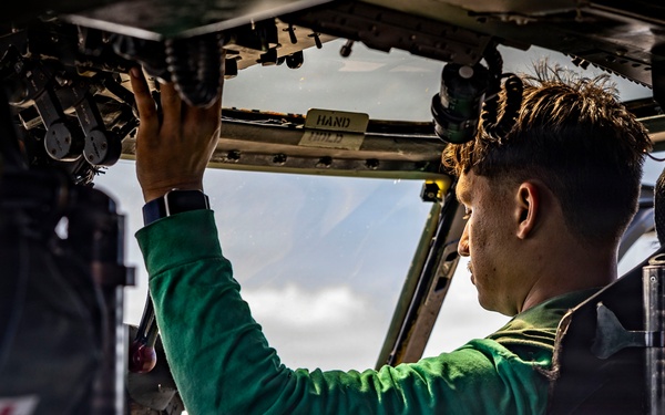 USS Iwo Jima Sailors Conduct MH-60S Sea Hawk Maintenance