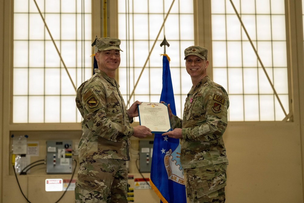 The door to the 90th and 525th FGS closes as the 3d AMXS opens