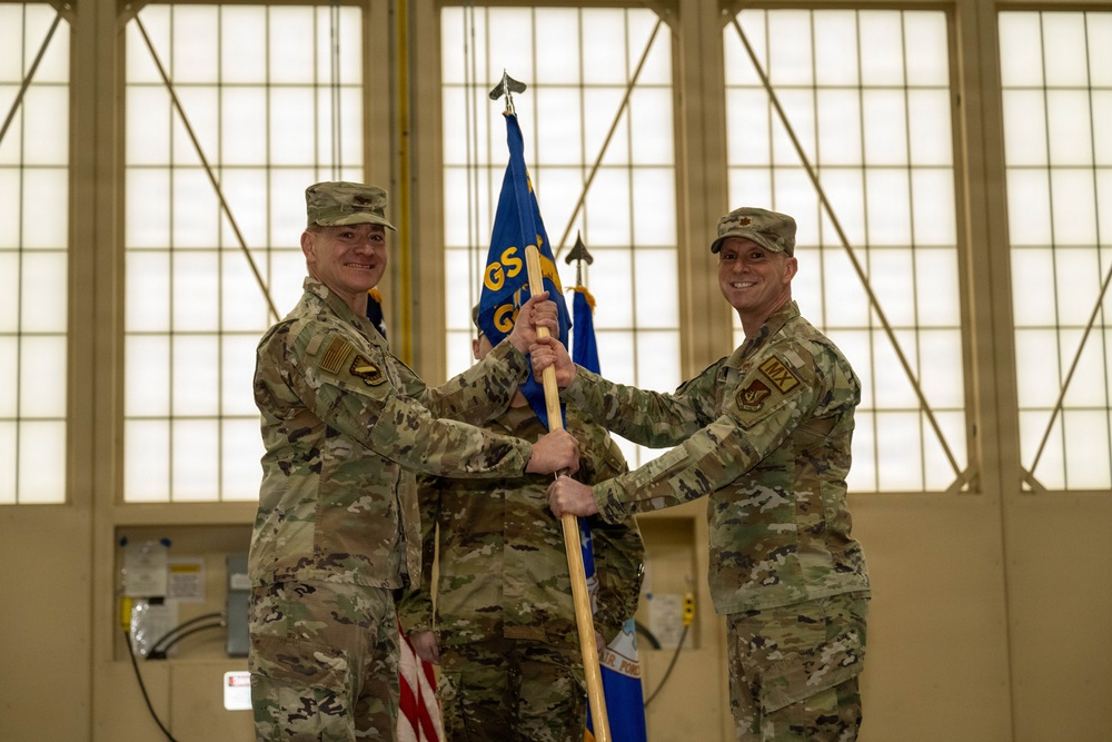 The door to the 90th and 525th FGS closes as the 3d AMXS opens