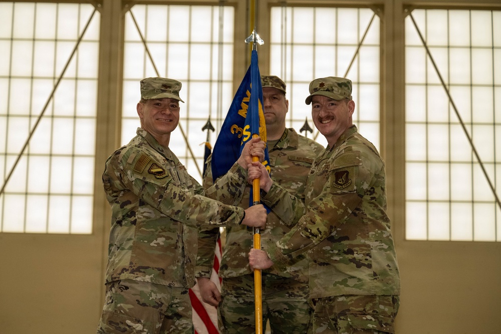 The door to the 90th and 525th FGS closes as the 3d AMXS opens