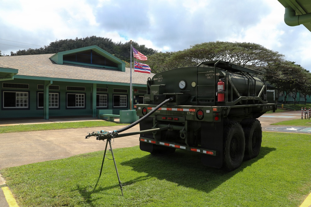 Hawaii National Guard assists Waialua residents with debris removal, water distribution