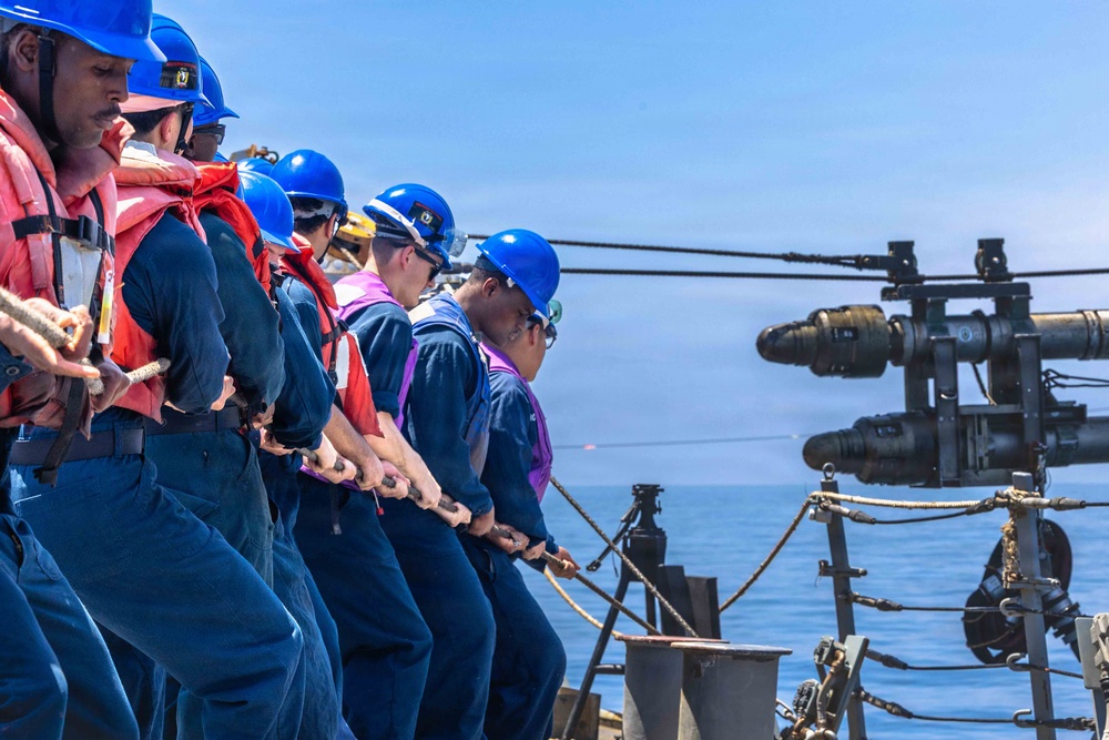 USS Milius (DDG 69) Conducts a Replenishment-at-Sea During Operation Epic Fury