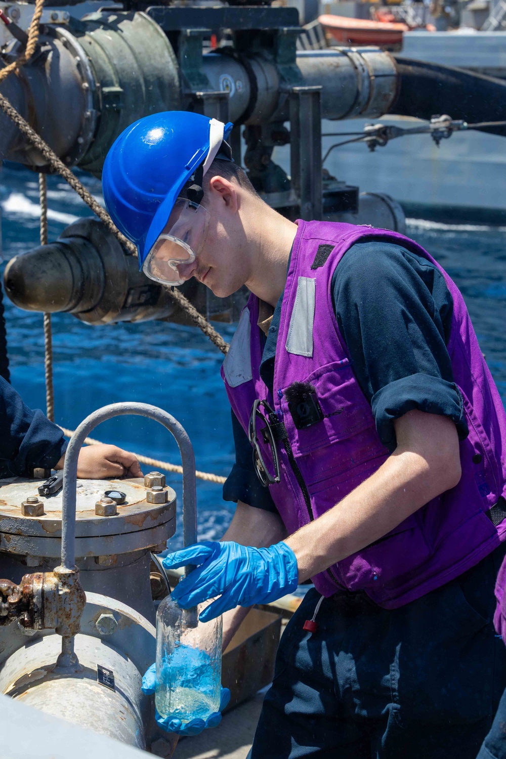 USS Milius (DDG 69) Conducts a Replenishment-at-Sea During Operation Epic Fury