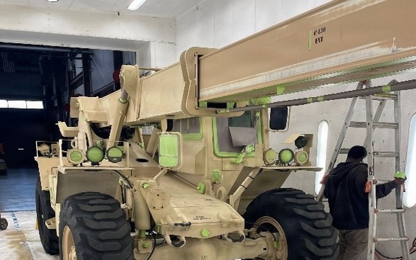 AFSBn-Bragg personnel prepare forklifts for CARC paint application