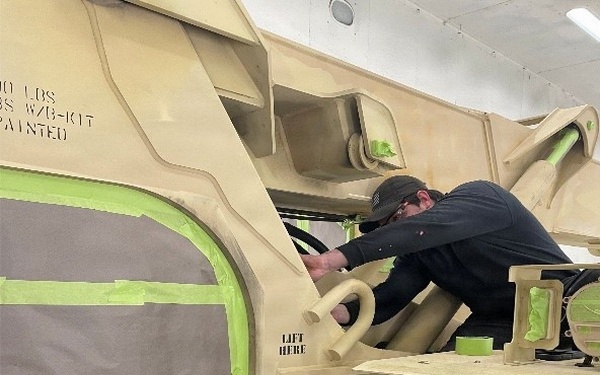 AFSBn-Bragg personnel prepare forklifts for CARC paint application