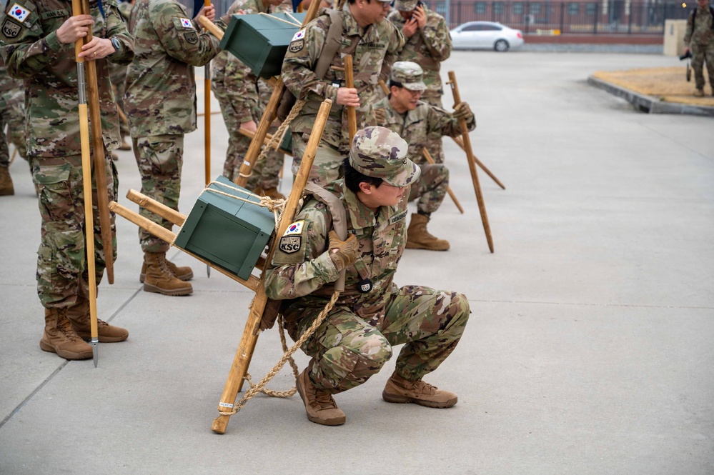 The Korean Service Corps (KSC) Battalion commemorated its 75th anniversary with an A-frame ruck march at Camp Humphreys on Mar. 26, honoring the tool's historical significance.