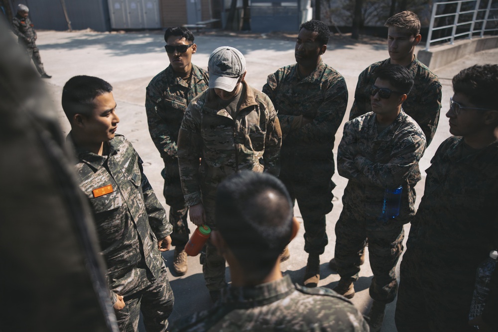 5th Air Naval Gunfire Liaison Company Marines, Republic of Korea service members conduct communications setup and weapons familiarization during Freedom Shield 26