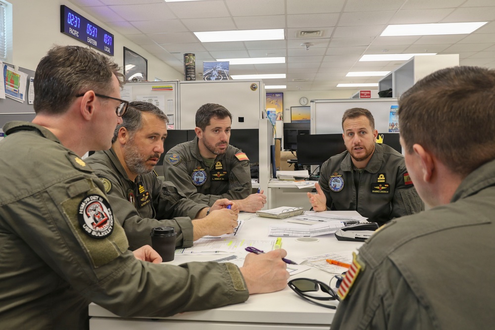 U.S. Navy service members from HSM-79 conduct interoperability planning with the Spanish Armada.