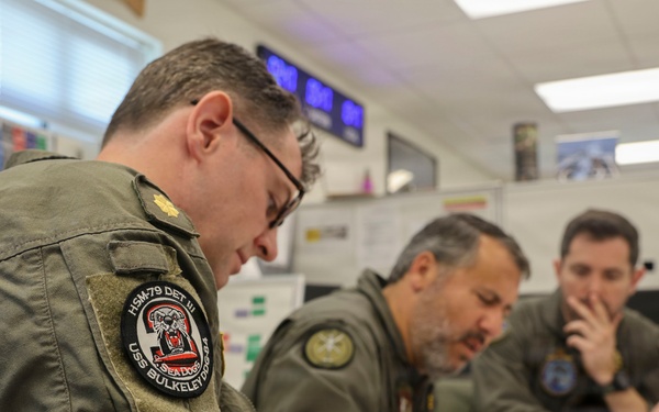 U.S. Navy service members from HSM-79 conduct interoperability planning with the Spanish Armada.
