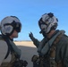 HSM-79 Commanding Officer Cmdr. Alex Haupt discusses pre-flight safety checks with Lt. Cmdr. Kyle O’Connell