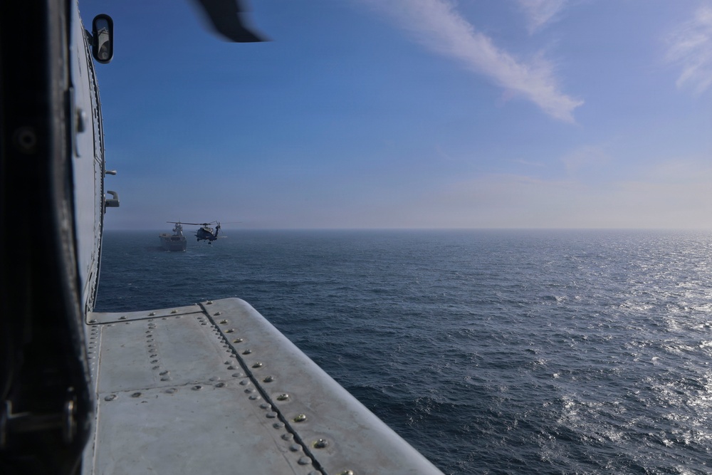 U.S. Navy MH-60R Seahawks from HSM-79 conduct interoperability exercises with the Spanish Juan Carlos I (L 61)