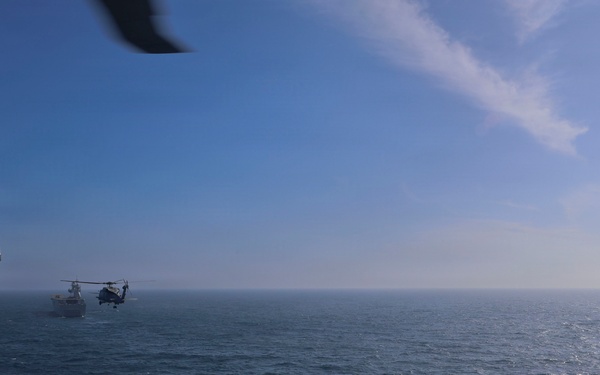 U.S. Navy MH-60R Seahawks from HSM-79 conduct interoperability exercises with the Spanish Juan Carlos I (L 61)